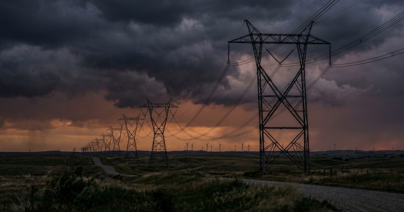 Power transmission lines against a stormy sky